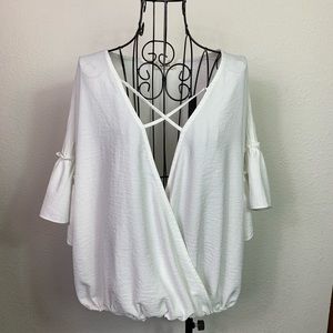 Adora blouse. Crossover front with sewn bottom